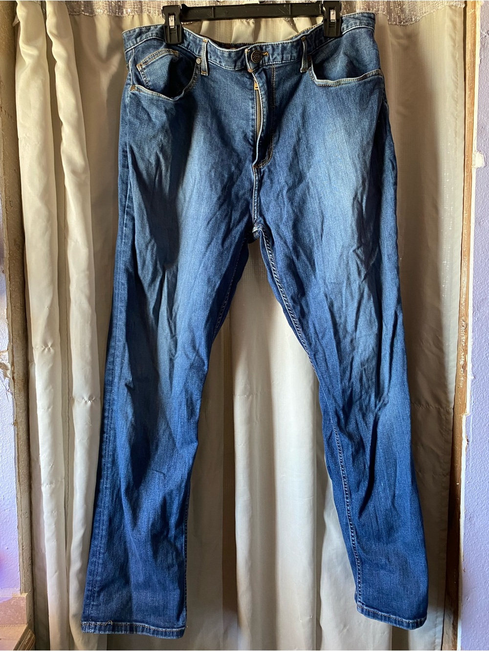 Johnston & Murphy Men's Denim Jeans, which are a casual straight-leg style